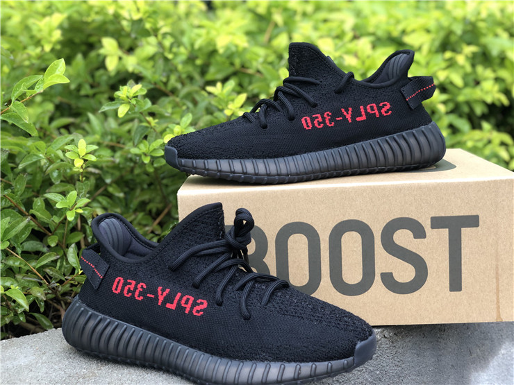 black yeezys with red letters